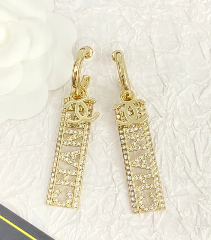 CC TEXT DIAMOND PAVED LIGHT GOLD DROP EARRINGS