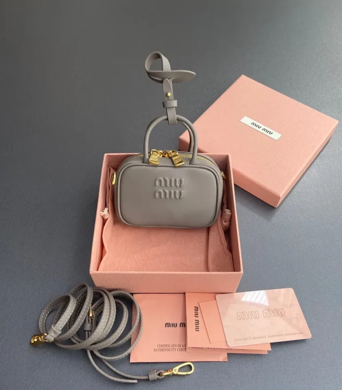 MICRO BAG KEYCHAIN 11 IN CLAY GREY CALFSKIN GOLD HARDWARE EMBOSSED LOGO