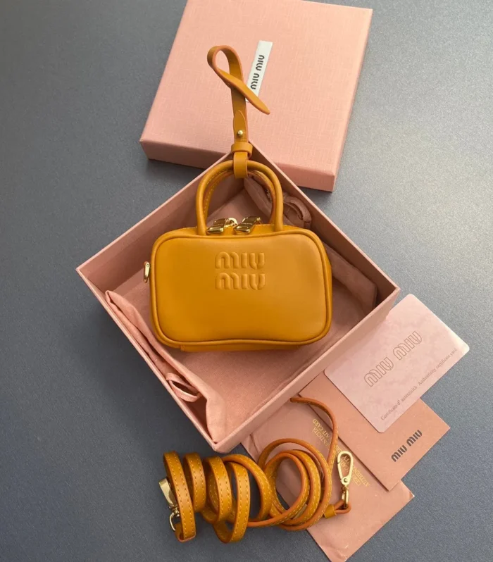 MICRO BAG KEYCHAIN 11  IN INDOCHINE ORANGE CALFSKIN EMBOSSED LOGO