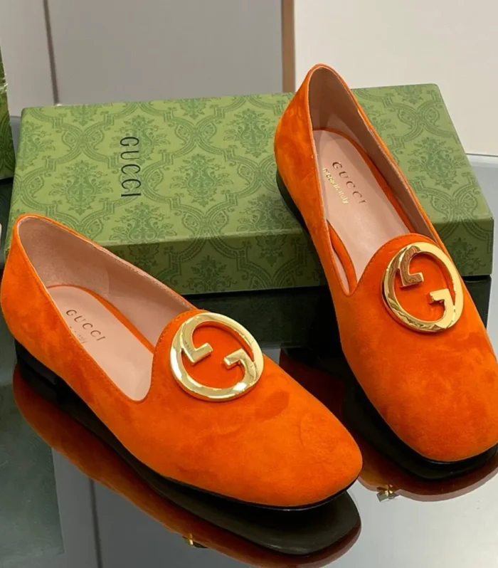BLONDIE LOGO-PLAQUE LOAFERS IN TIGER ORANGE SUEDE