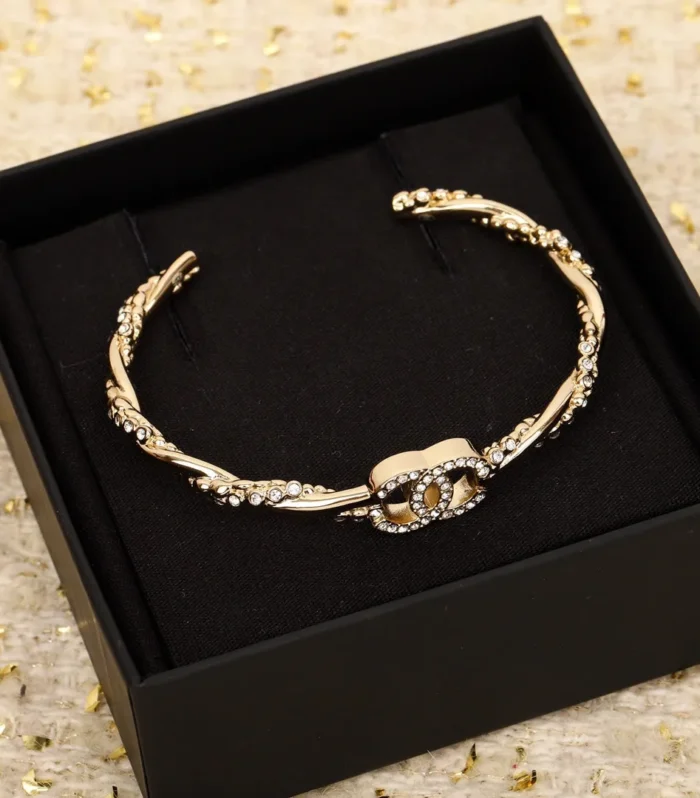 CC TWIST OPEN CUFF GOLD BRACELET